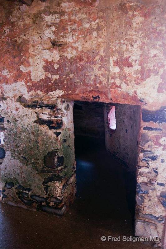 20090528_103731 D300 P1.jpg - A Cell which held about 20 Individuals.  Placards on the wall indicate the separation:   men, women, young girls.  Children under 8 were kept together regardless of age.  Some of the cells were used as 'Dentention Cells' which held those who tried to foment rebellion among the captured.